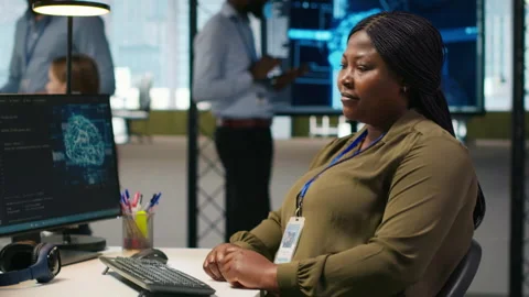 Jolly female programmer at office desk pleased after developing application Stock Footage 313164716