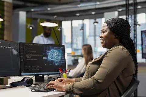 Jolly programmer at work training machine learning models Stock Photos