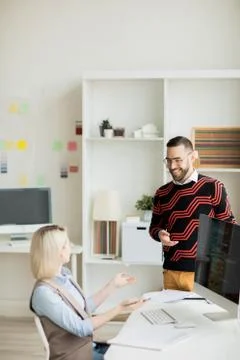 Jolly programming specialists discussing software system Foto stock