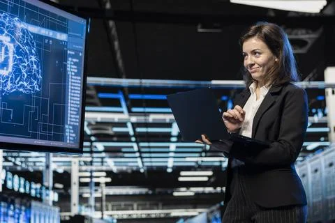 Jolly server room software developer using AI feeling happy Stock Photos