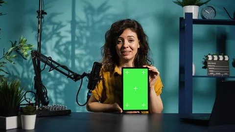 Jolly woman filming tech tutorial on how to repair damaged mockup tablet Fotos Stock
