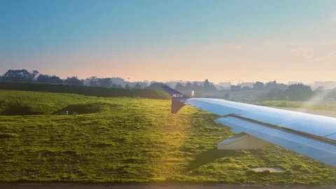 Joon airplane preparing for take off at sunset Lisbon airport Stock Footage 110817265