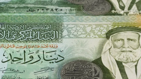 Jordan 1 dinar notes tracking. Jordanian currency. Slider shot, low angle. 4K Stock Footage 125998100