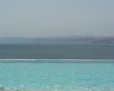 Jordan. Dead Sea. View of Dead Sea waters through hotel pool. Stock Footage 114649191