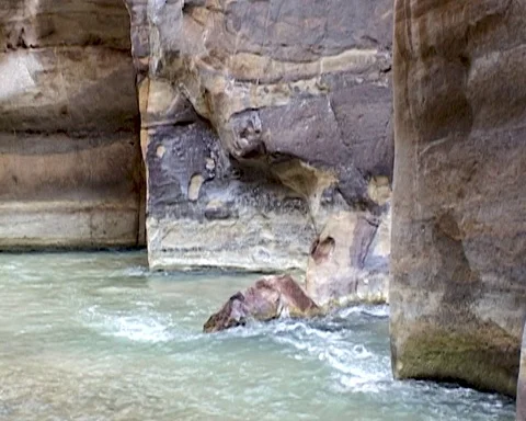 Jordan. Mujib River canyon of Wadi Mujib is lowest nature reserve in the world Stock Footage 126957859