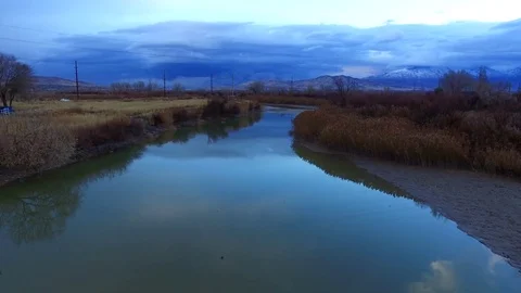 Jordan River Elevation with Storm Clouds and Mountains Vídeos de archivo 70866063
