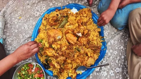 Jordan shared chicken rice platter with salad and yogurt communal dining ha.. Stock Footage 329966836