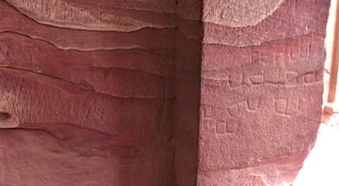 Jordan. Texture of layers of red sandstone on walls of cave temples in of Petra. Stock Footage 149301375