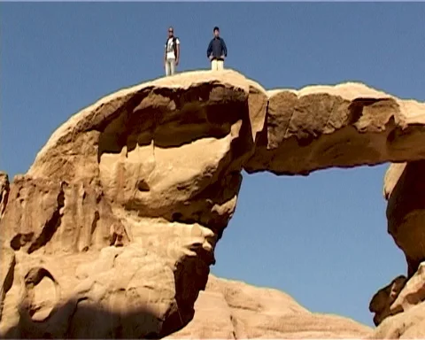 Jordan. Wadi Rum Desert. Two people stand on rock. Vintage video. May 2011. Stock Footage 120721849