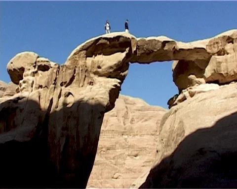 Jordan. Wadi Rum Desert. Two people stand on rock. Vintage video. May 2011. Stock Footage 120721854