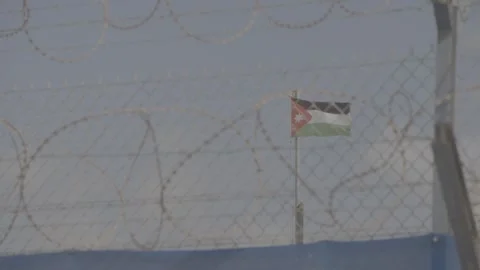 Jordanian flag behind barbed wire Video stock 244704656