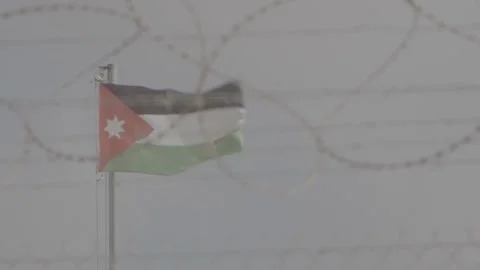Jordanian flag behind barbed wire 스톡 동영상 244704665