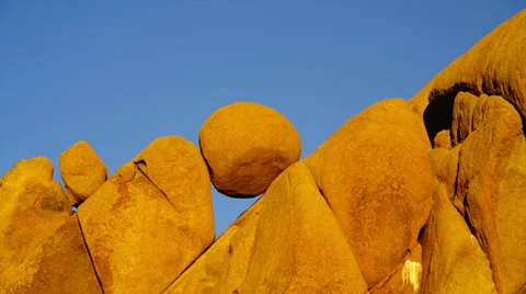 JOSHUA TREE NATIONAL PARK – BOULDERS AND BLUE SKY # 4 Stock Footage