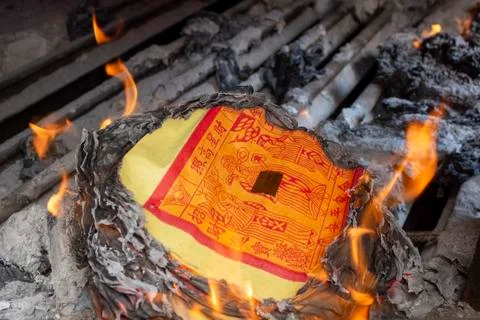 Joss paper burning Stock Photos