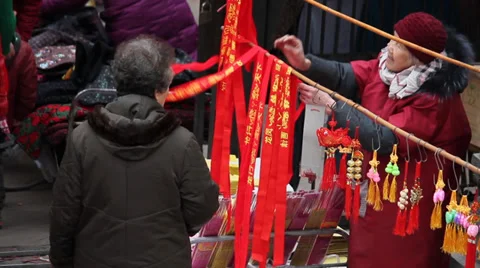 Joss sticks and articles for use to pray sold at a market Stock Footage 34331087