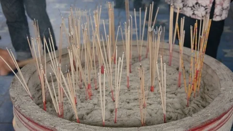 Joss sticks in to pot Stock Footage 83791856