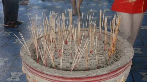 Joss sticks in to pot Stock Footage 83791860