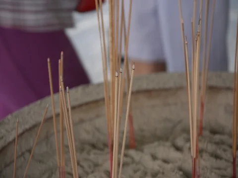 Joss sticks in to pot Stock Footage 83791869