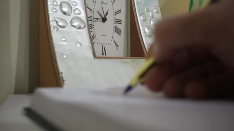 Jotting things down in his journal Stock Footage 322195603