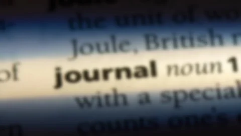Journal word in a dictionary. Stock Footage 99561792