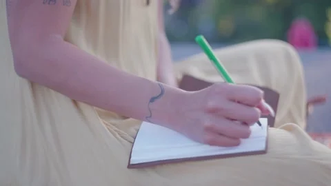 Journaling Outside in the Summer Stock Footage 236950676