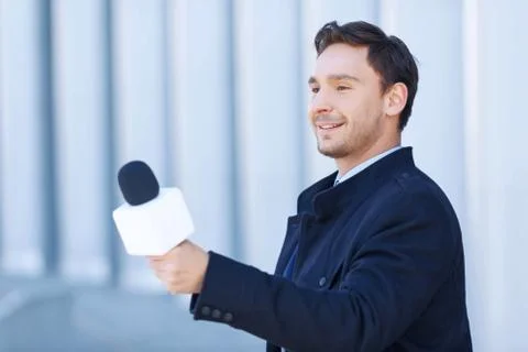 Journalist in action of taking personal interview Stock Photos