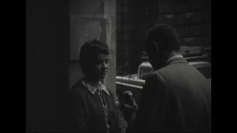 A journalist asks about intellectual opposition to communism to a girl - 1959 Video stock 105723810
