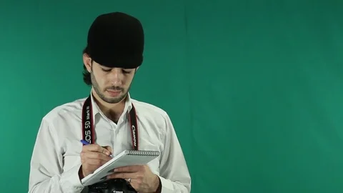 A journalist filming on green screen Stock Footage
