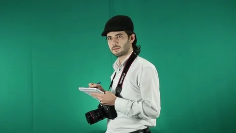 A journalist filming on green screen Stock Footage