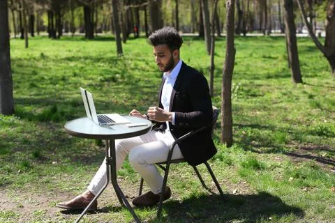 Journalist finished work in park Stock Photos