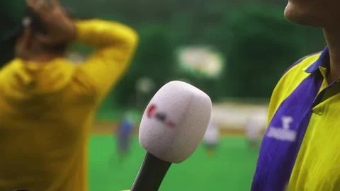 A journalist interviews an athlete at a sporting event. Journalist's Day.  Stock Footage 279880959