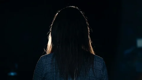 Journalist making a live broadcast in front of a spotlight Video stock 119985044