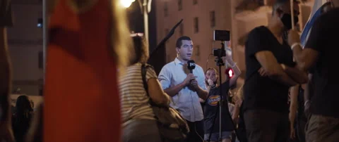 Journalist reporting news from protests Stock Footage 152848163