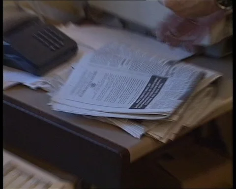 Journalist sitting at the table and working on newspaper article, UK 1990 Video stock 147438098
