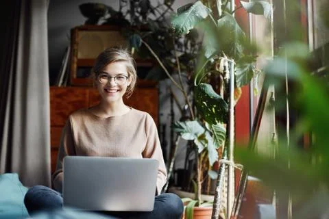 Journalist taking interview from creative female designer at her home. Girl in Stock Photos