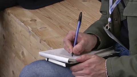 Journalist taking notes Stock Footage 81455422