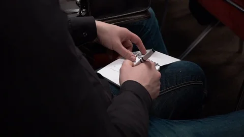 Journalist taking notes on the paper notepad Stock Footage 91552361