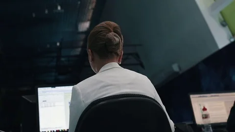 A journalist working on a computer in Newsroom Stock Footage 75950319