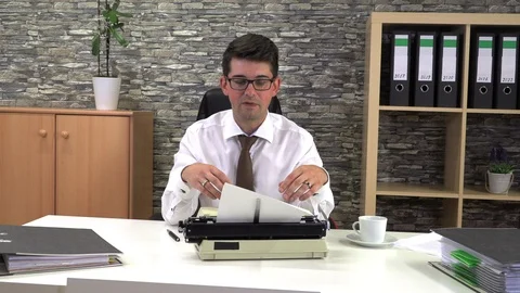 Journalist writes an article on a typewriter at a table in the workplace Stock Footage 115790467