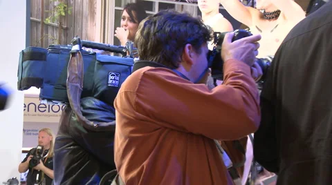 Journalists at a fair Stock Footage 64127539