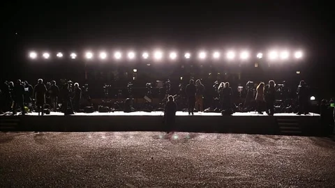 Journalists making a live broadcast on a large scene in front of spotlights 스톡 동영상 172020168