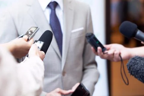 Journalists making media interview with unrecognizable business person Stock Photos