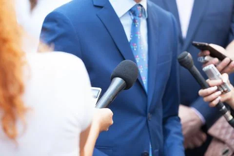 Journalists making media interview with unrecognizable business person Stock Photos