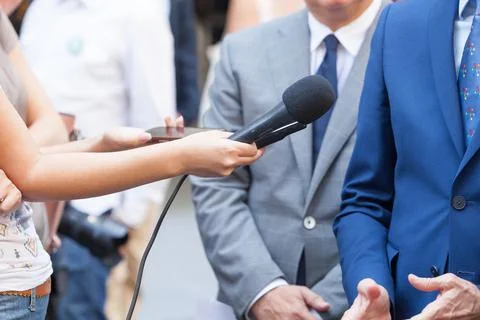 Journalists making media interview with unrecognizable business person Stock Photos
