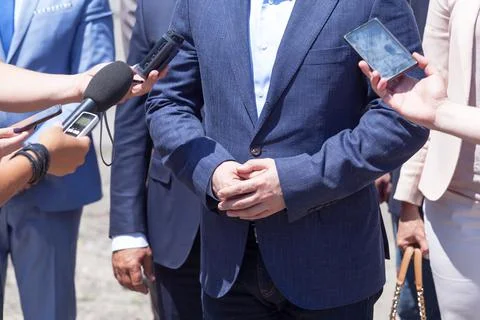 Journalists making media interview with unrecognizable business person Stock Photos
