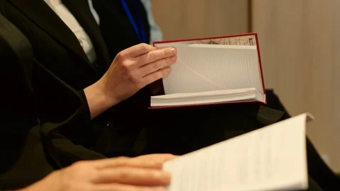 Journalists at the press conference make notes in a notebook and audio recording Video stock 101971154