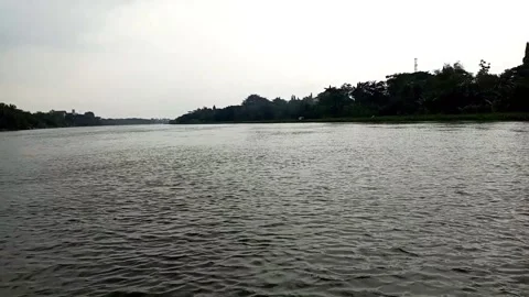 A journey of a boat crossing a large river Stock Footage 274257595