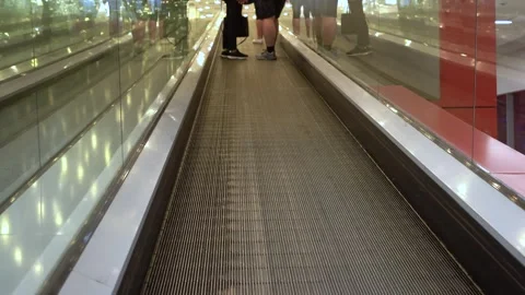 Journey Through a Modern Walkway: Capturing the Experience on a Moving Sidewalk Stock Footage 313930902