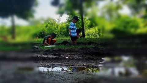 The joy of three small children playing with water and mud. Stock Photos