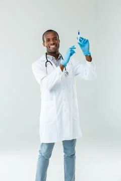 Joyful afro american practitioner preparing for vaccination Stock Photos